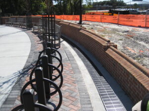 Curved trench drain at park retaining wall