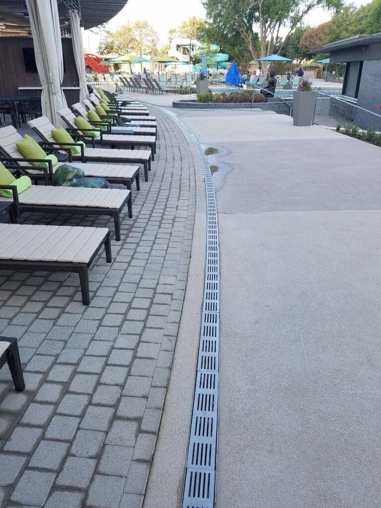 Radius trench drain on pool deck